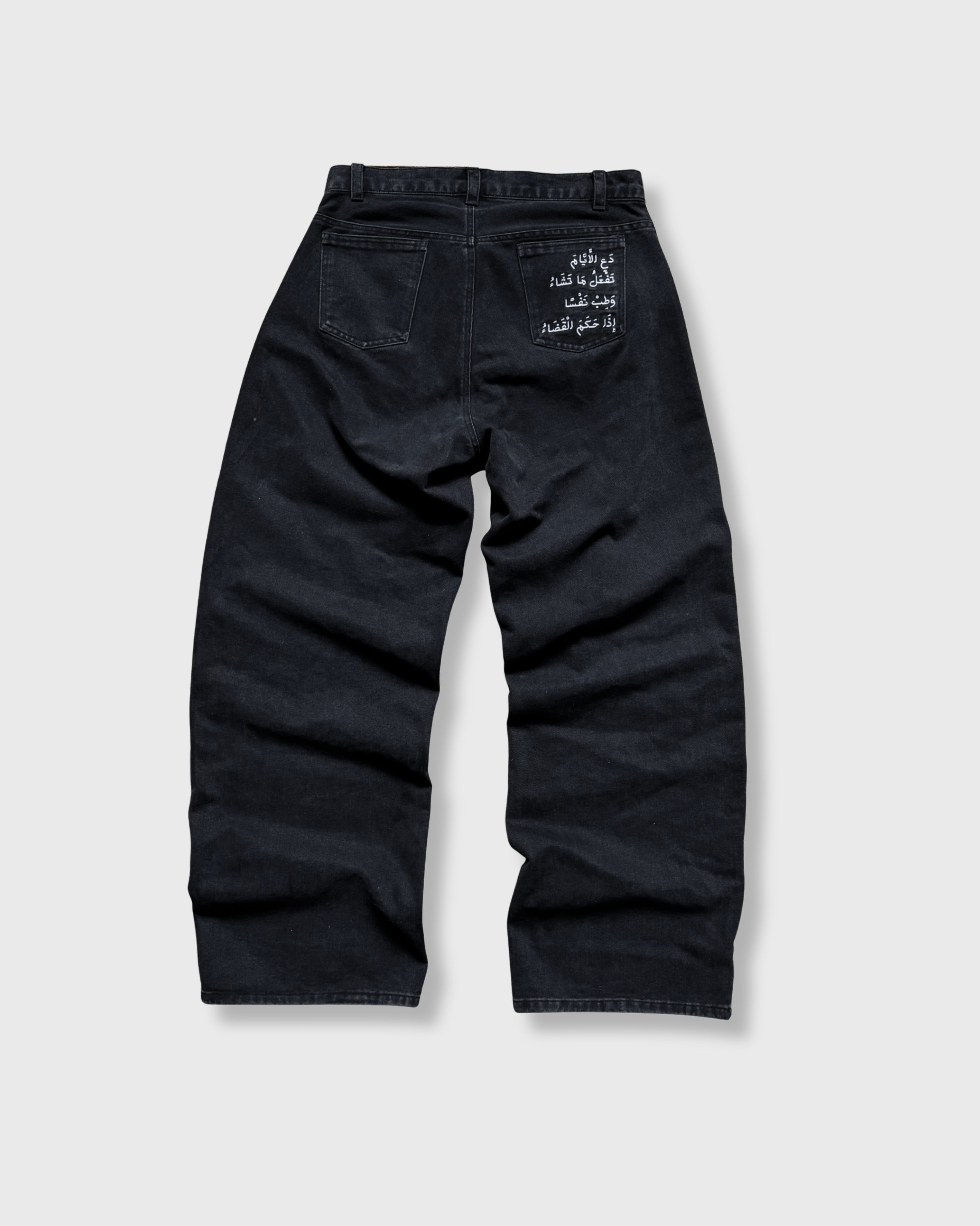 Black jeans on a light gray background